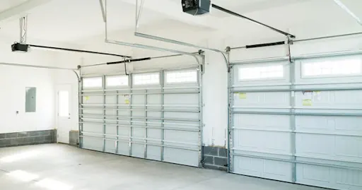 Two-car garage interior with two doors and openers